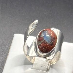 A Size 9 Rough cut Mexican Fire Opal with a oval Cabochon SS setting
